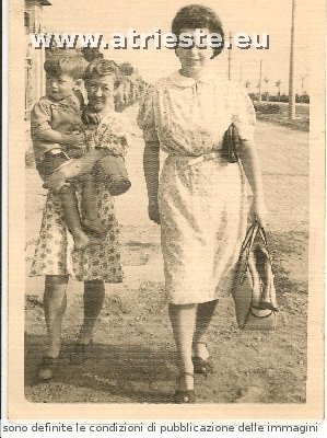 Mollie Andrew (carrying Leslie age 3) and lady (possibly the maid) in Venice 1946.
