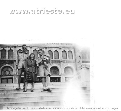 Mollie Andrew with two soldiers and son Leslie age 3. Outside Hotel Excelsior Venice 1946.